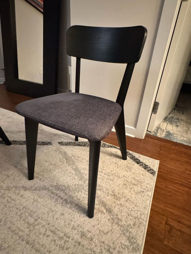 1. Reperch dining chair with dark wood frame and upholstered seat, pictured in a home interior setting.