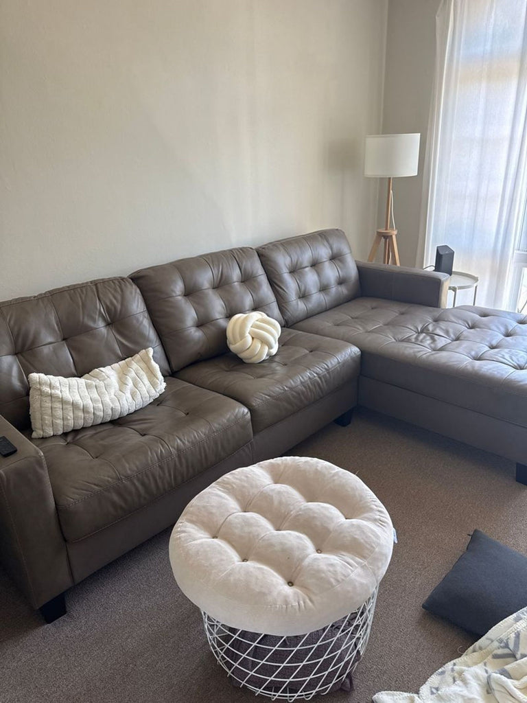 Brown leather sectional sofa in great condition, only a year old, category: Sectional.  