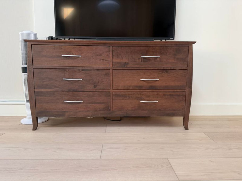 2. Dark wood Reperch dresser with six drawers and metal handles, placed below a TV in a modern room.
