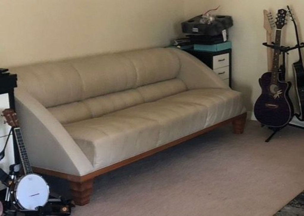 Elegant Giorgetti 3-seat sofa featuring a sleek black leather finish, sturdy base, and contemporary style.