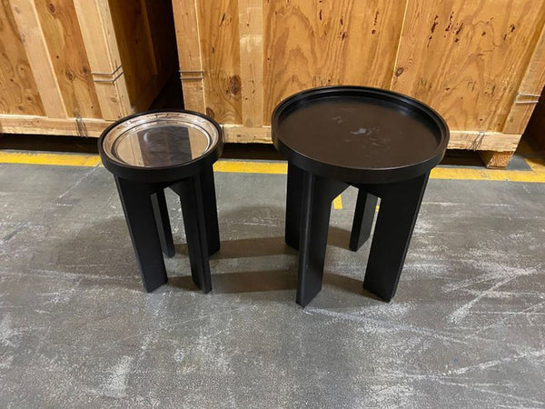 Set of two modern Holly Hunt M side tables with sleek metal bases, designed in 2015, priced at $5000.