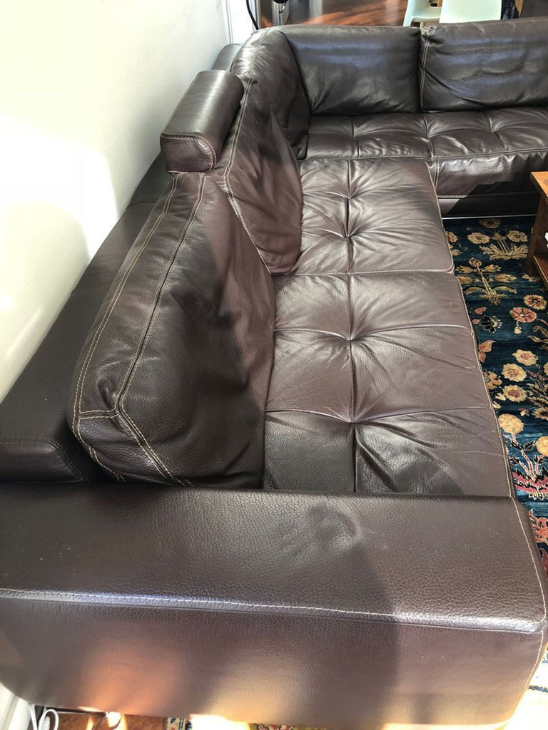 L-shaped Cierre Imbottiti sectional featuring soft brown leather, tufted cushions, and spacious seating.