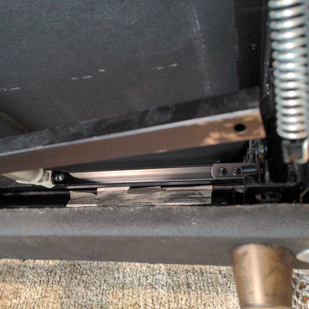 2. Close-up of the reclining electric mechanism underneath the Reperch 3-seat electric couch.