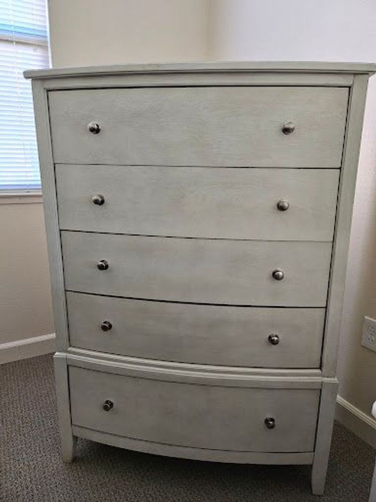 a dresser with a drawer and drawers