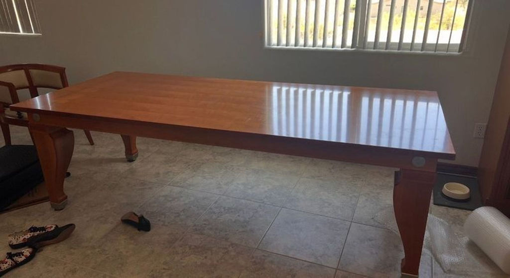 Spacious dining set by Giorgetti with a sleek wooden table and eight upholstered wooden chairs.