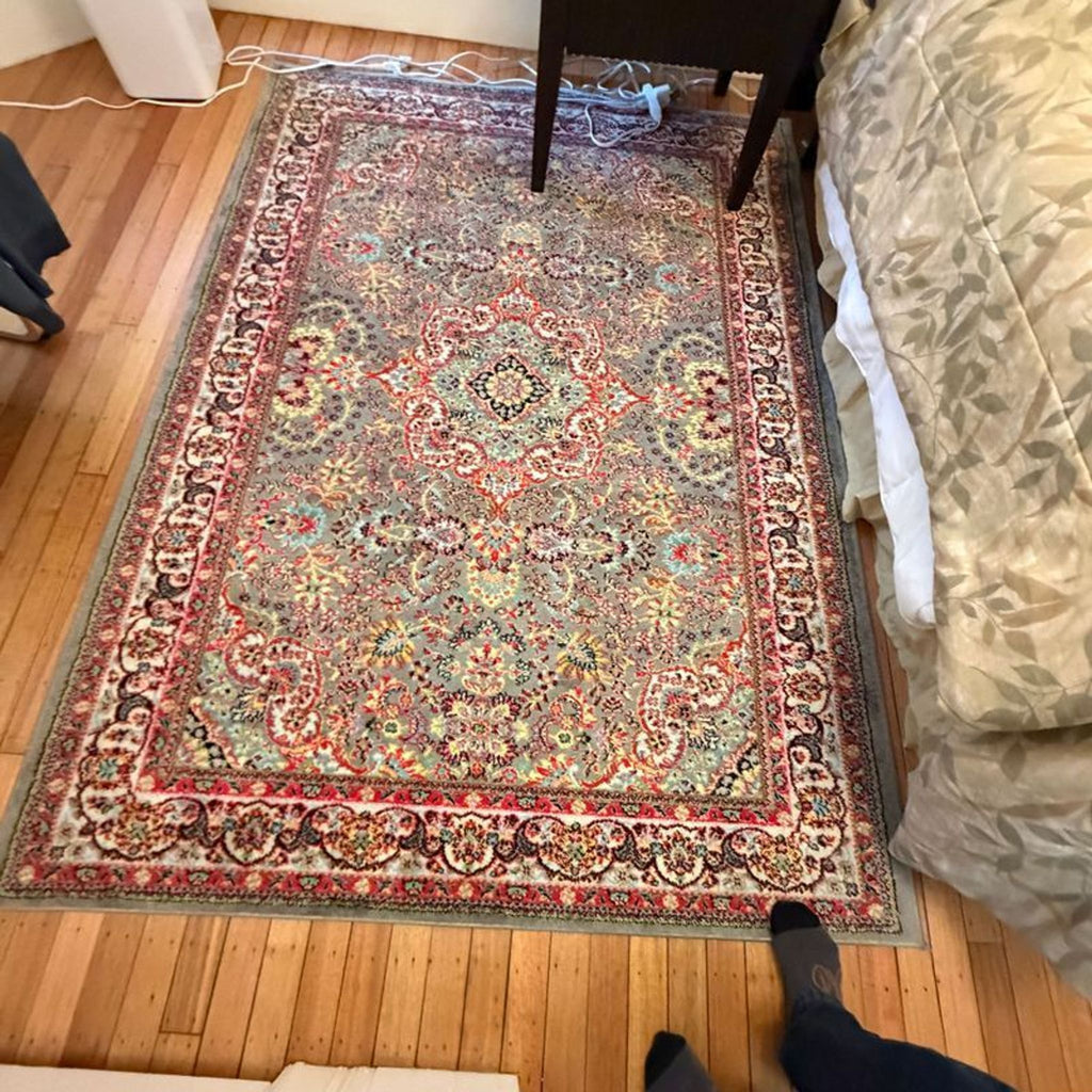 1. Neutral-toned 6x9 area rug shown flat against a white background, highlighting its size and texture.
