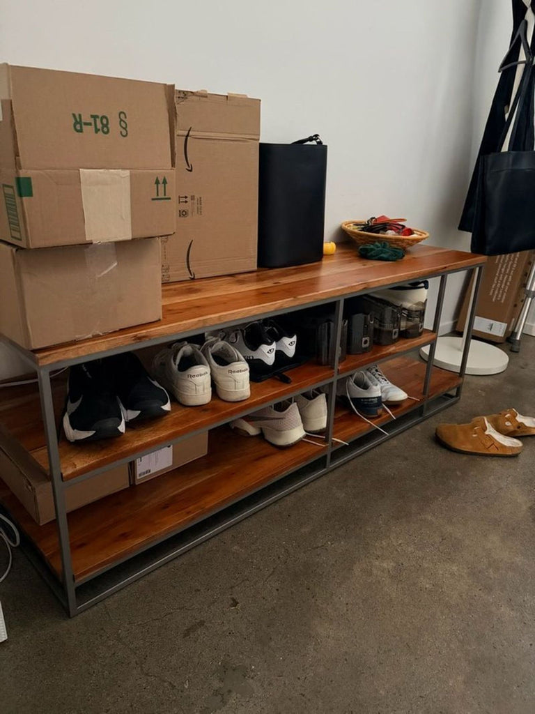 1. Reperch Entertainment Center with wooden shelves and metal frame, used for shoe and box storage in entryway.