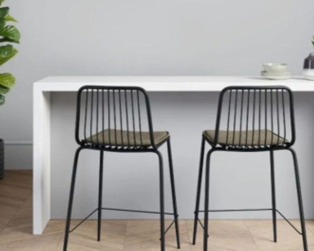 Set of two modern counter-height chairs with low backrests and wooden frames, from Project 62.  