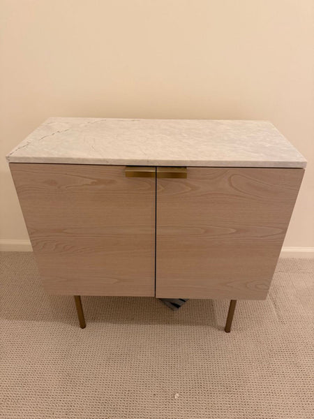 1. West Elm cabinet from 2022 featuring clean lines and modern wood design.  