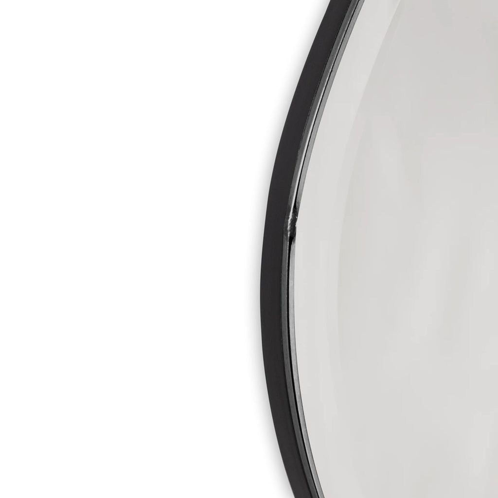 Close-up of the 2Modern mirror’s edge, showing the organic chrome-finished frame detail.