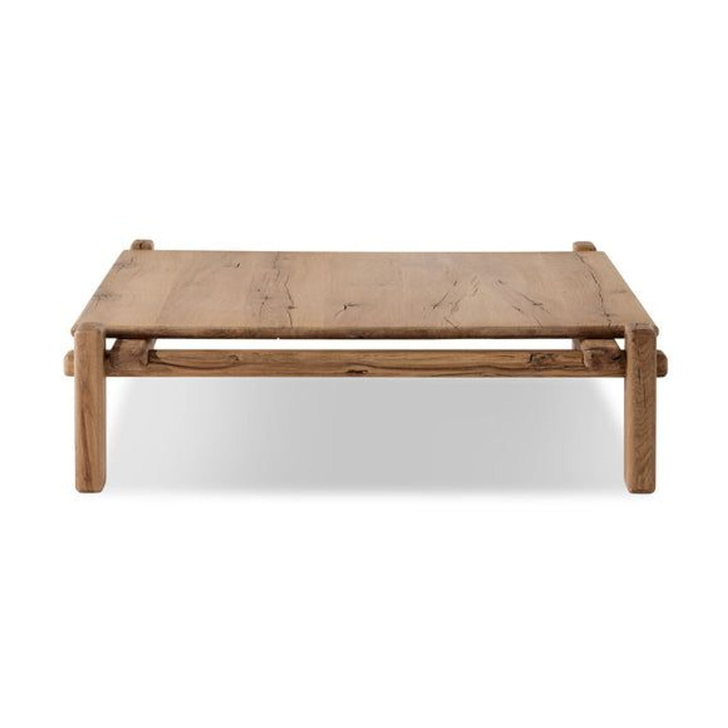 the coffee table is made from reclaimed wood and has a natural finish.