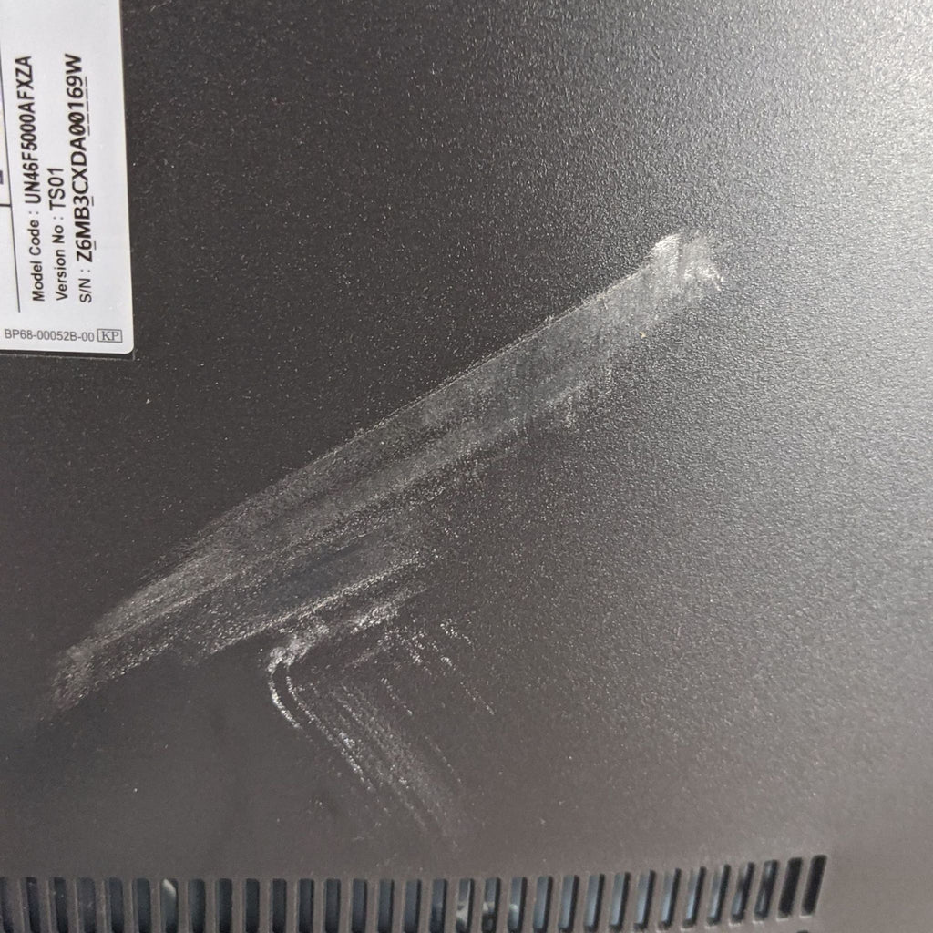 Back of Samsung TV showing label and fingerprint smudges.