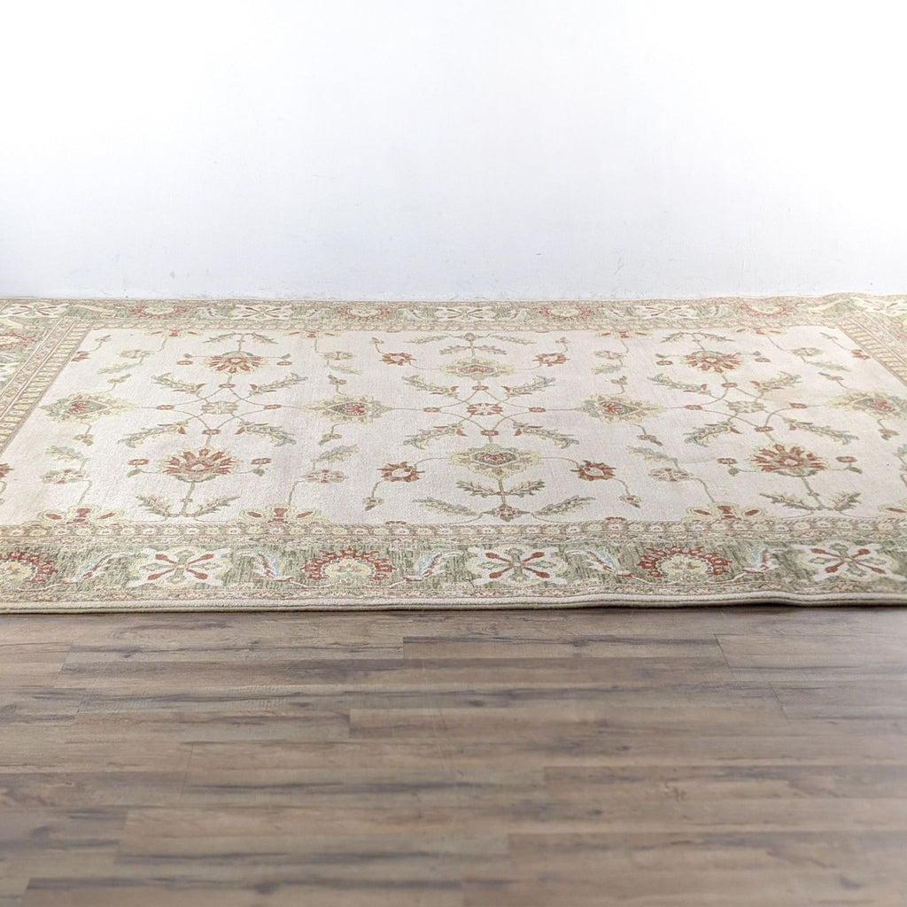a hand - knotted rug with a floral pattern.