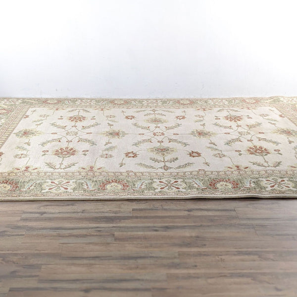 a hand - knotted rug with a floral pattern.