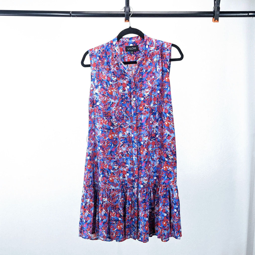 Front view of a colorful floral dress by Saloni, featuring a flowing design and a ruffled hem.