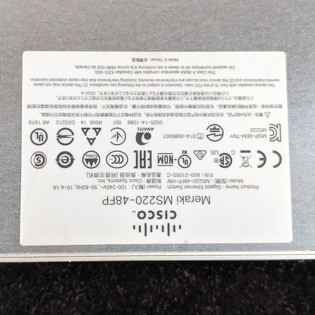Close-up of the product label on a Cisco & Bros. Meraki MS220-48FP switch, featuring regulatory certification symbols.