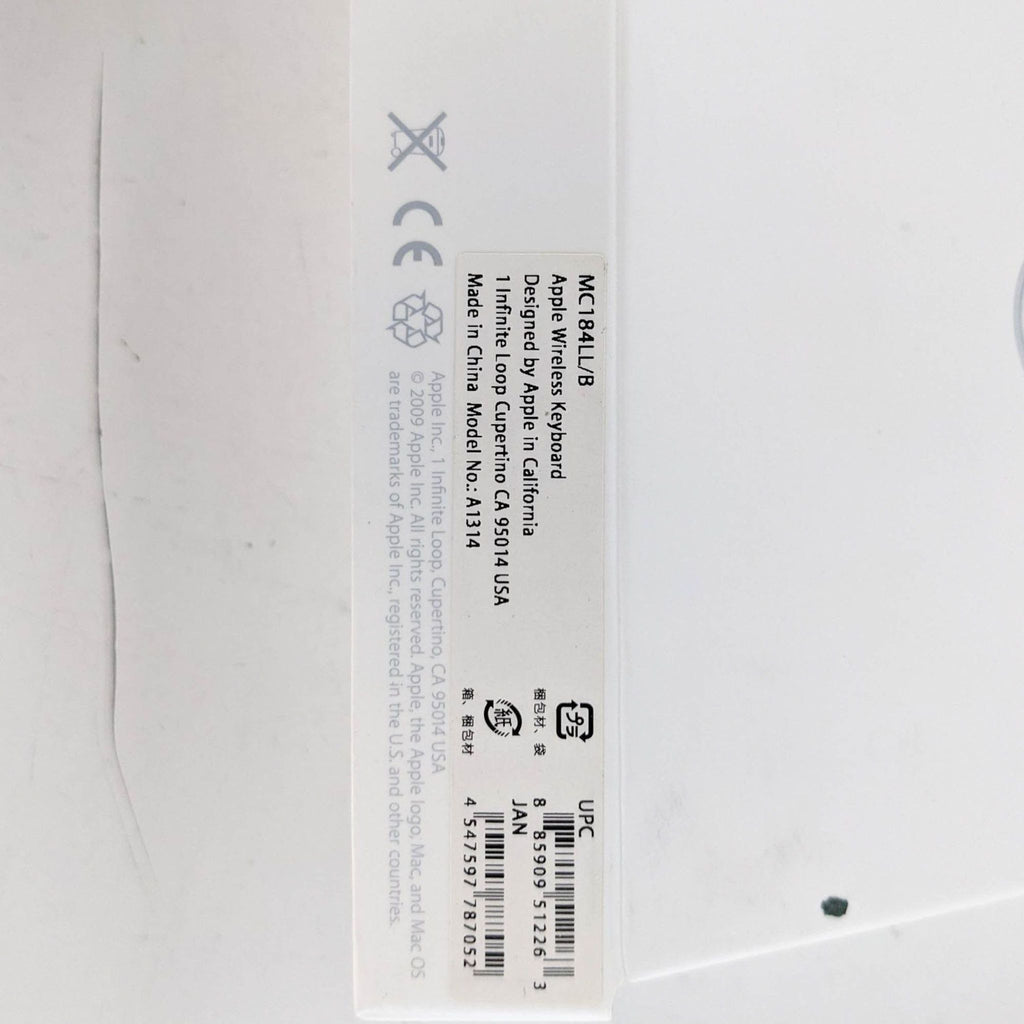 Close-up of the label on an Apple wireless keyboard box, showing model and design details.