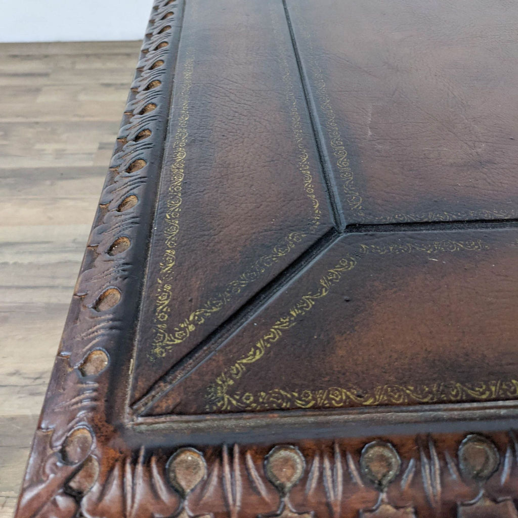 Close-up of the carved leather top featuring intricate details.