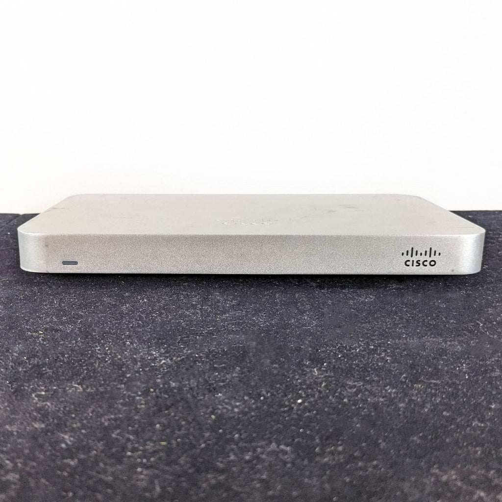 1. Front view of a Cisco & Bros. networking equipment device with a minimalist gray design and brand logo.