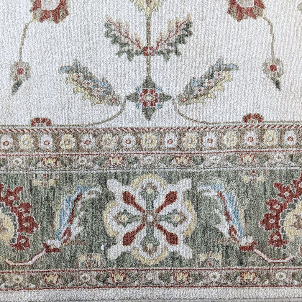 a close up of a hand - painted rug with a floral design.