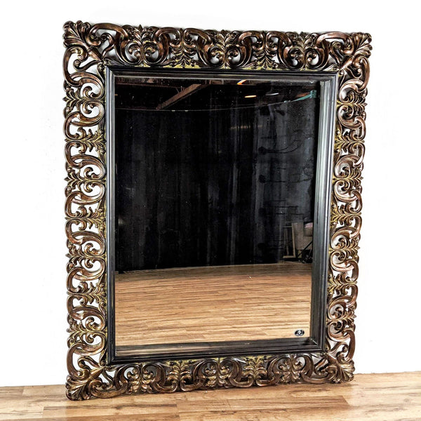 Full-length mirror with a classic brown vine-patterned, burnished wooden frame.