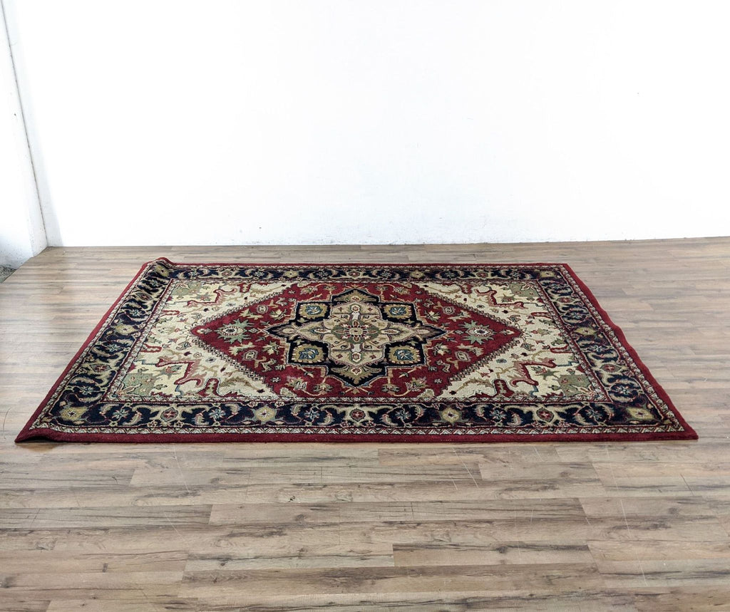 1. Safavieh Heriz style rug, 100% wool, red with intricate medallion pattern, approximately 6' x 9', made in India.