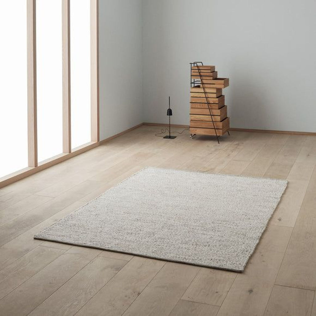 the flooring is a natural wood floor with a natural finish.