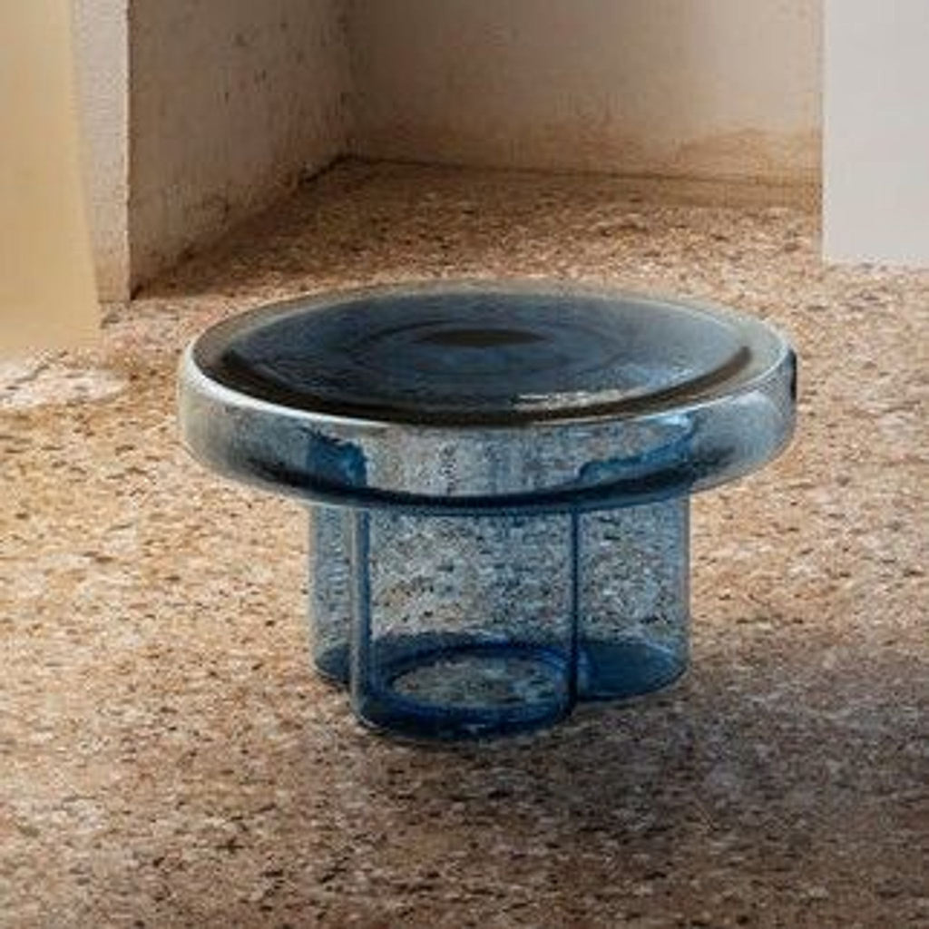 a glass bowl sitting on top of a floor.