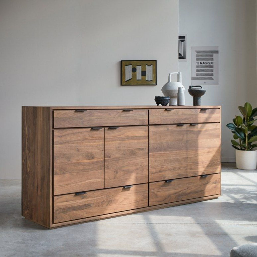 1. Tikamoon solid walnut sideboard with multiple storage compartments, shown in a bright modern room with décor items.