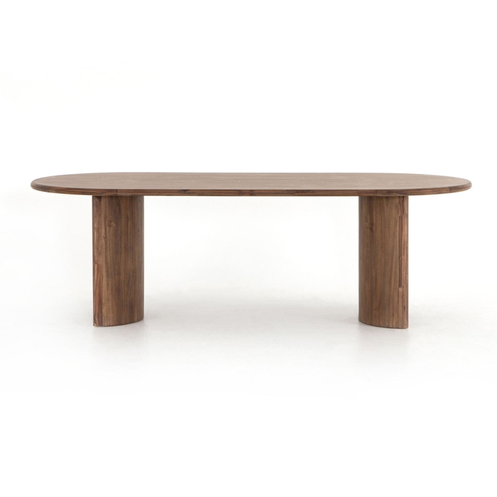 the dining table is a modern dining table with a rounded top.