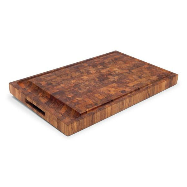 Close-up of a Dania Cutting Board by Fritz Hansen, showing a mosaic of light and dark teak end grain.  
