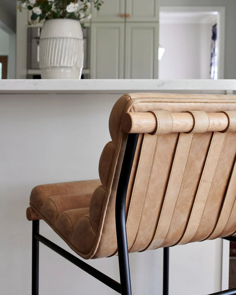 a leather bar stool in a kitchen