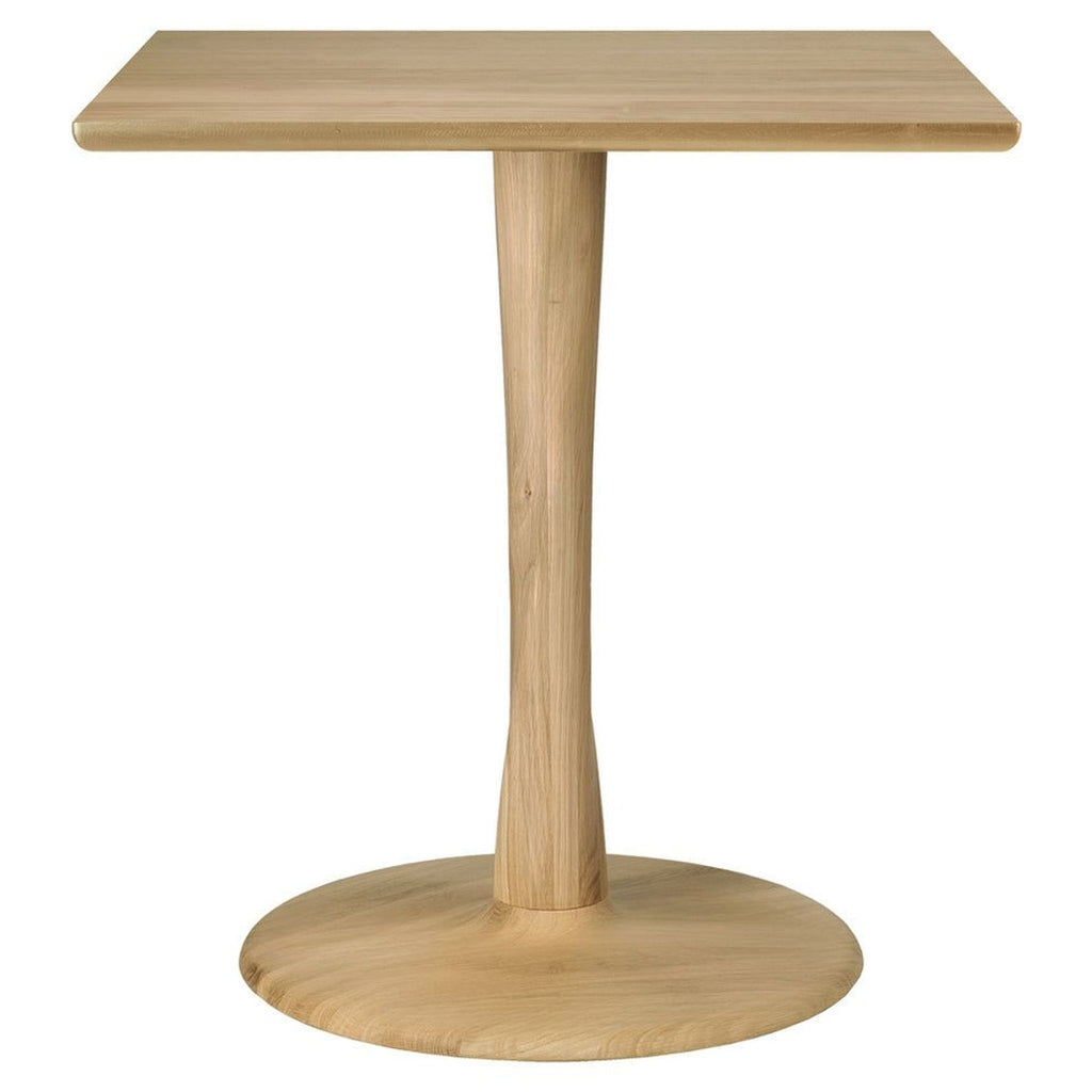 1. Modern wooden dining table with a rectangular top and four matching chairs, set in a bright dining room.