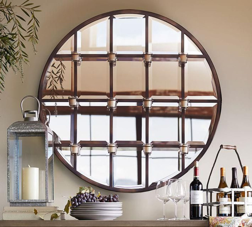 a round mirror with a wooden frame.