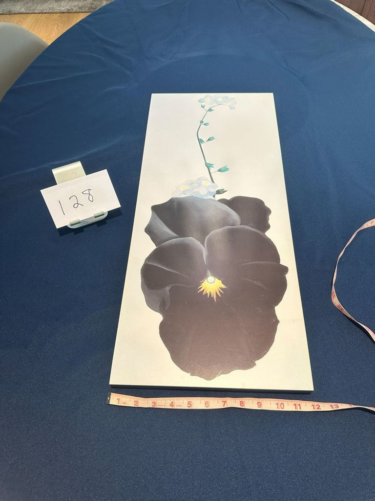 2. Drawing showing a big dark bloom with yellow center and blue flowers, next to a measuring tape and label "128".