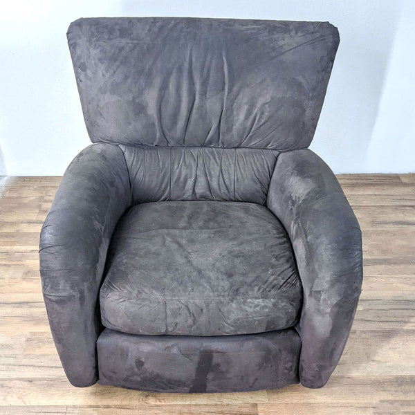 Charcoal gray suede Reperch swivel chair, front view, on wooden floor.