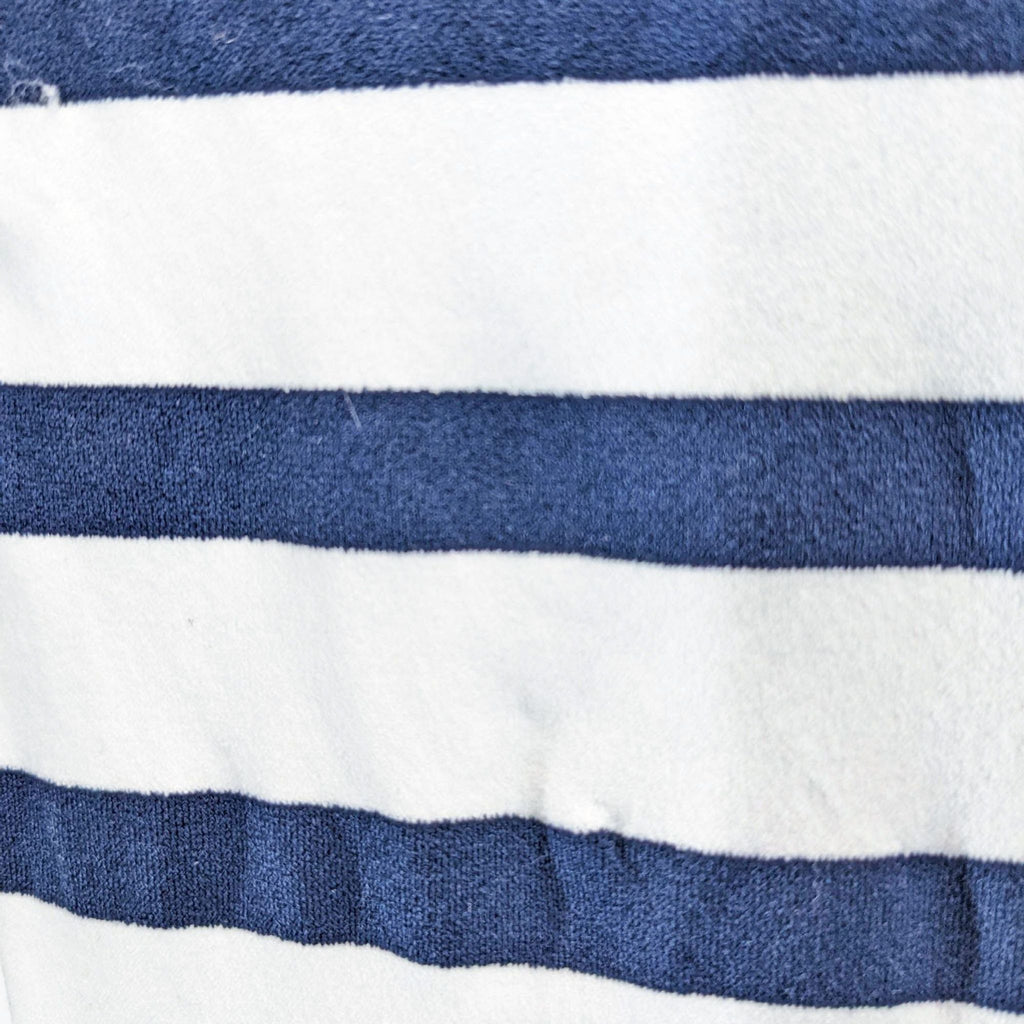 a close up of a blue and white striped shirt.