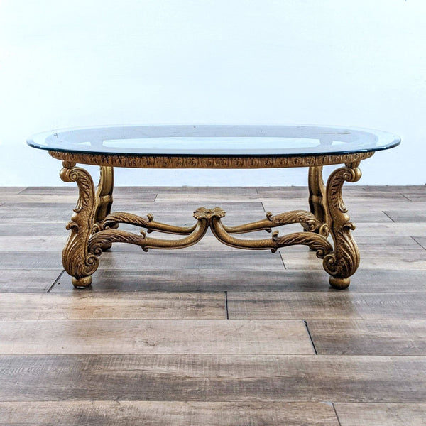 Reperch brand coffee table with antiqued base and intricate metal details, glass top visible.