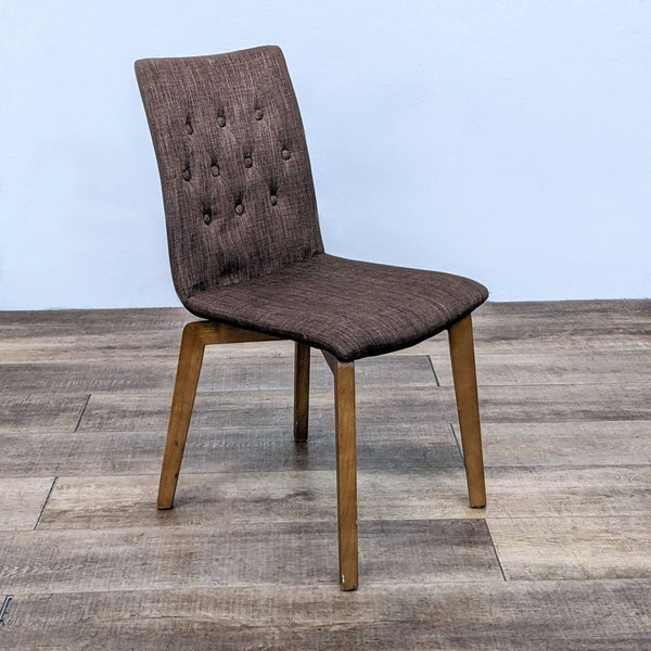 Contemporary Zuo Modern Orebro dining chair with wood frame and tufted brown polyester blend upholstery.