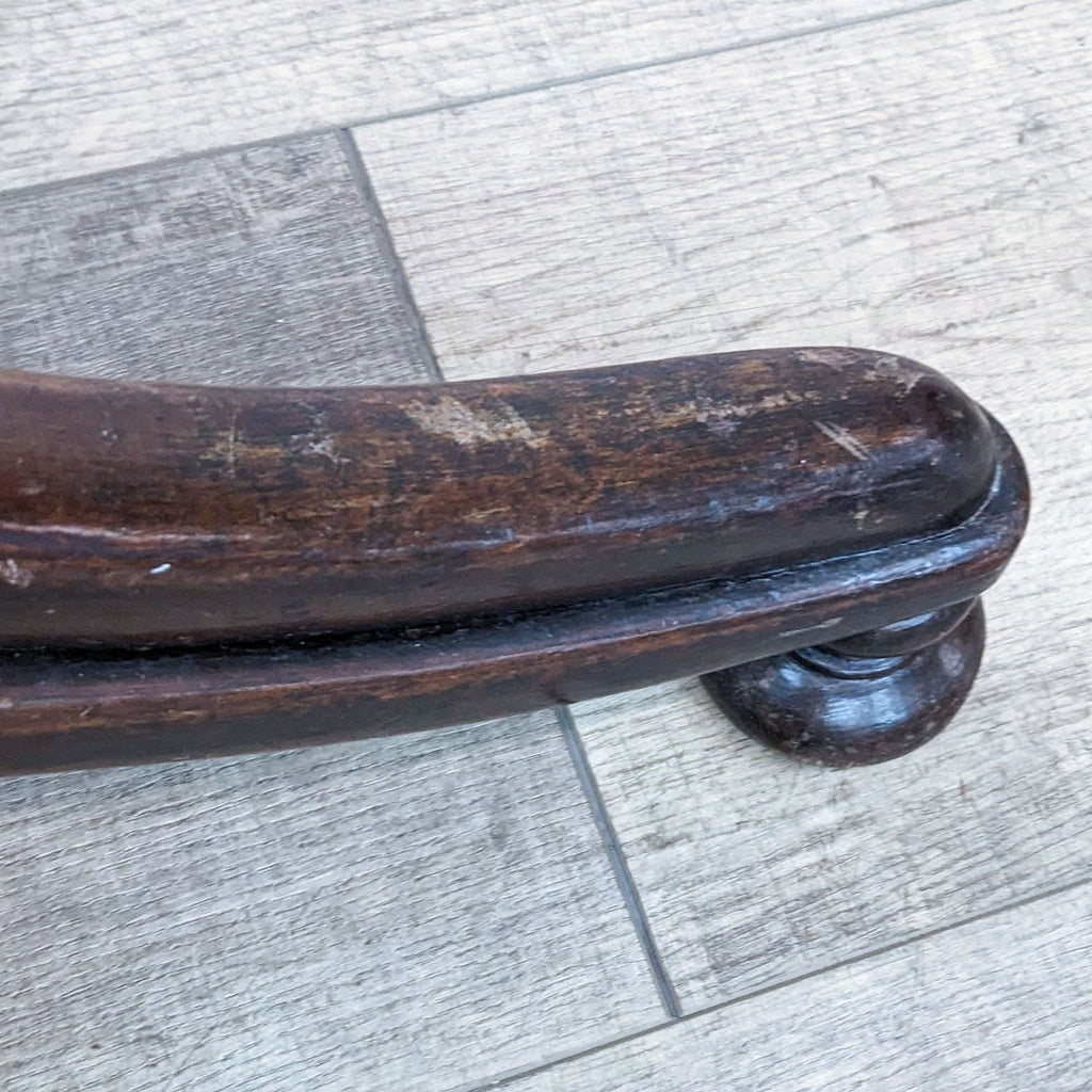 Close-up of a Thonet art nouveau wooden coat rack detailing the curved wood and patina.