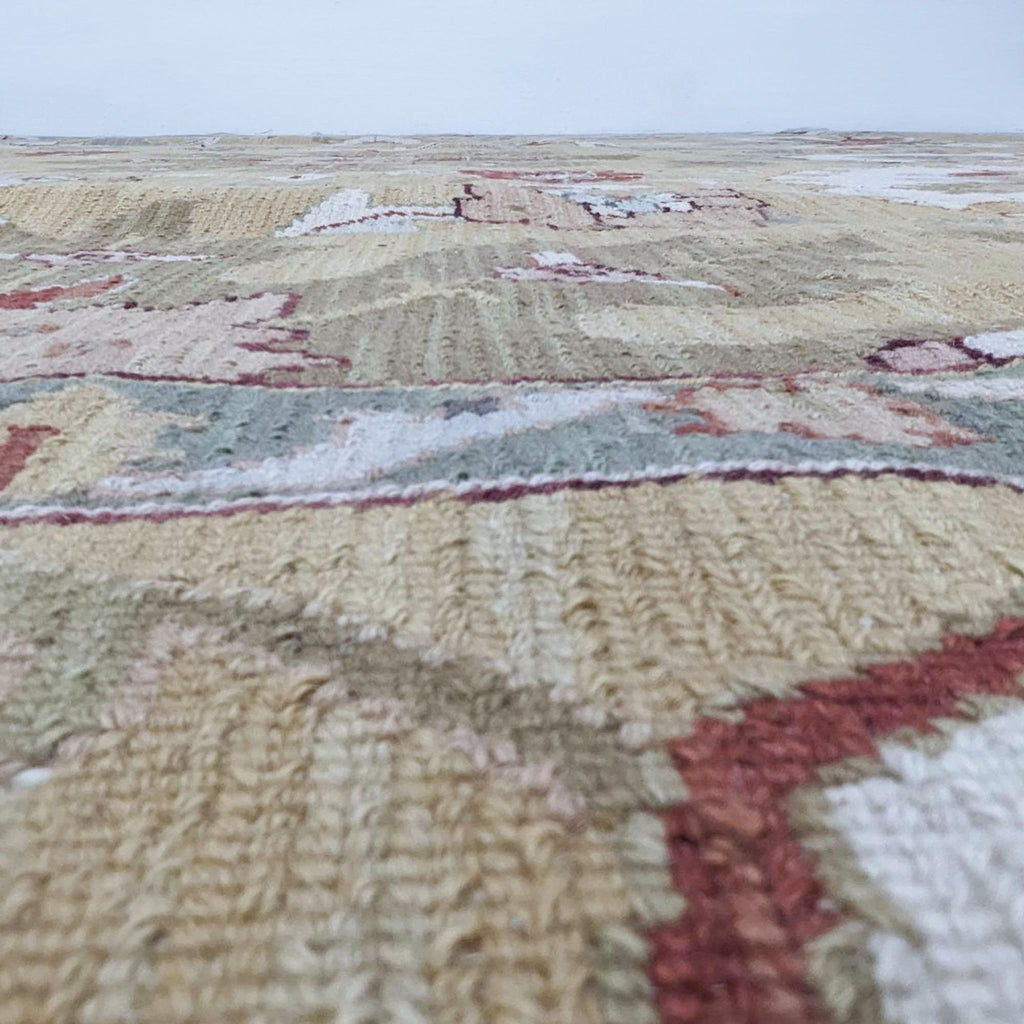 Close-up of a Nourison Home Nourmak S174 Gold Wool Flatweave Rug showcasing its texture and pattern.
