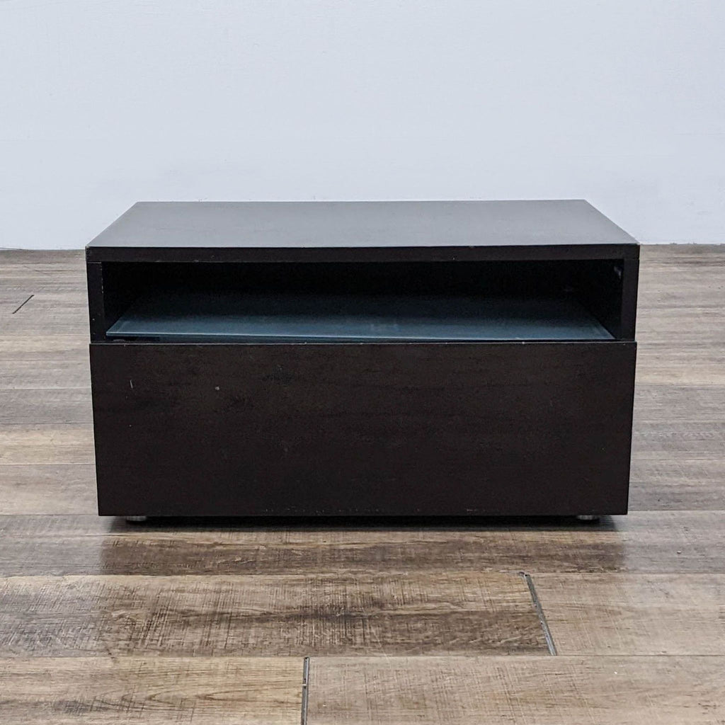Front view of a Reperch brand end table in dark finish with an open storage compartment.