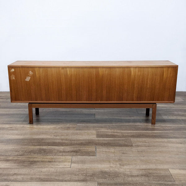 1. Reperch entertainment center with a simple wooden design, shown from the front, displaying some surface wear.