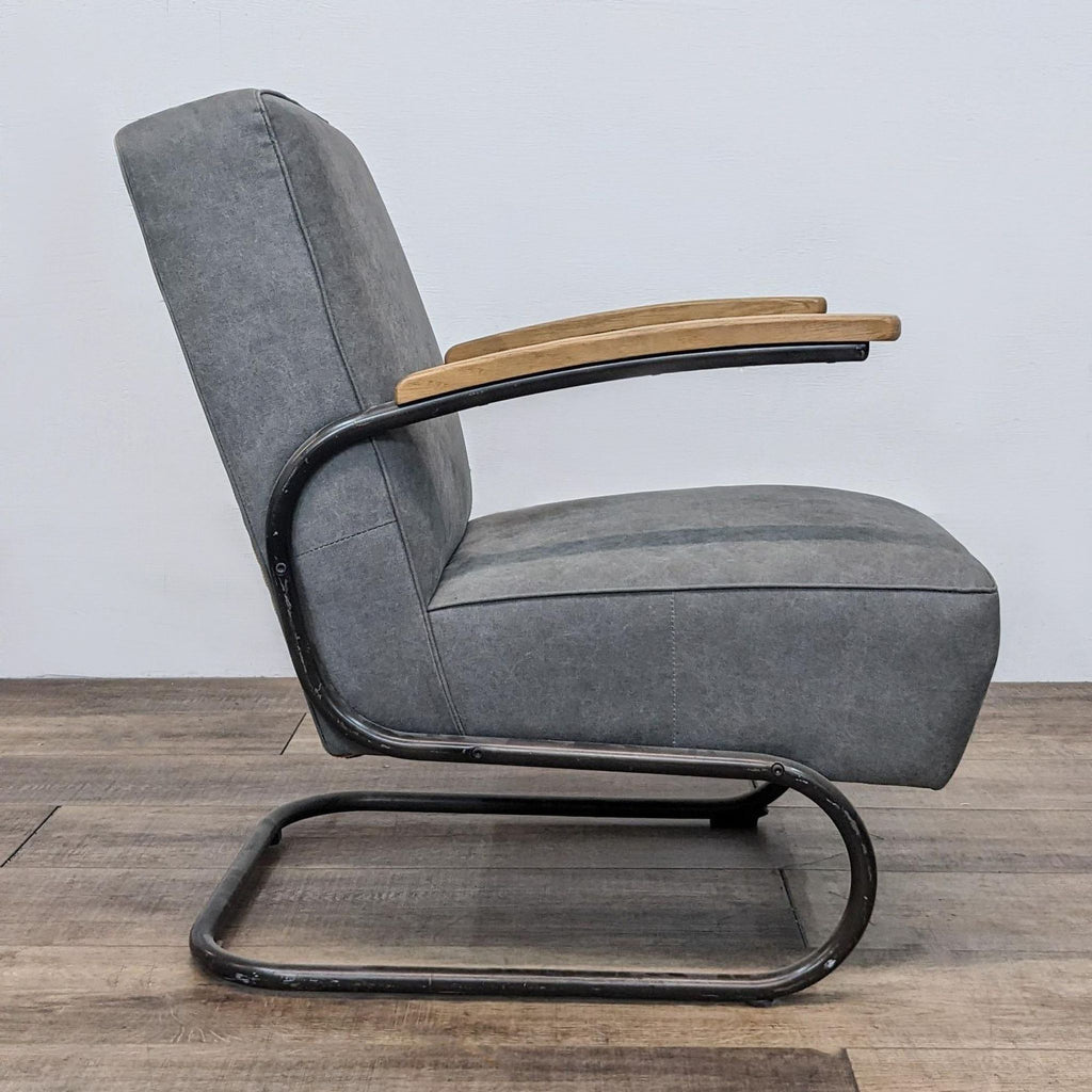 Side view of a Reperch mid-century modern grey lounge chair, highlighting the steel S-frame and wooden armrests.