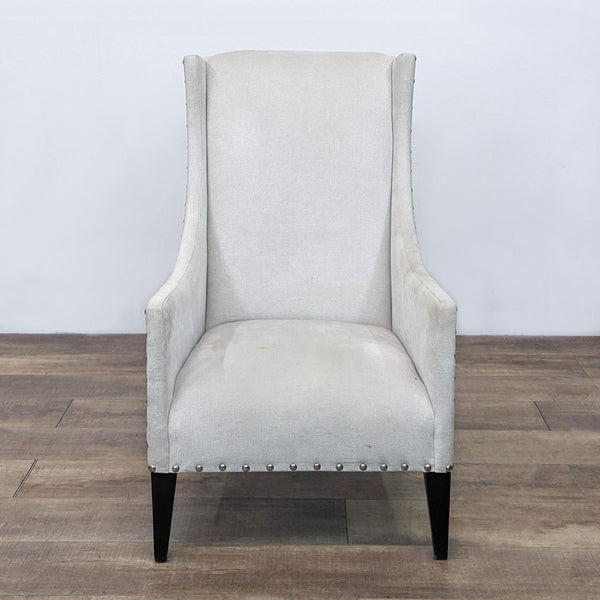 Alt text 1: A Reperch brand contemporary wingback chair with linen blend fabric, nailhead trim, and solid angled wood legs, on a wooden floor against a white backdrop.