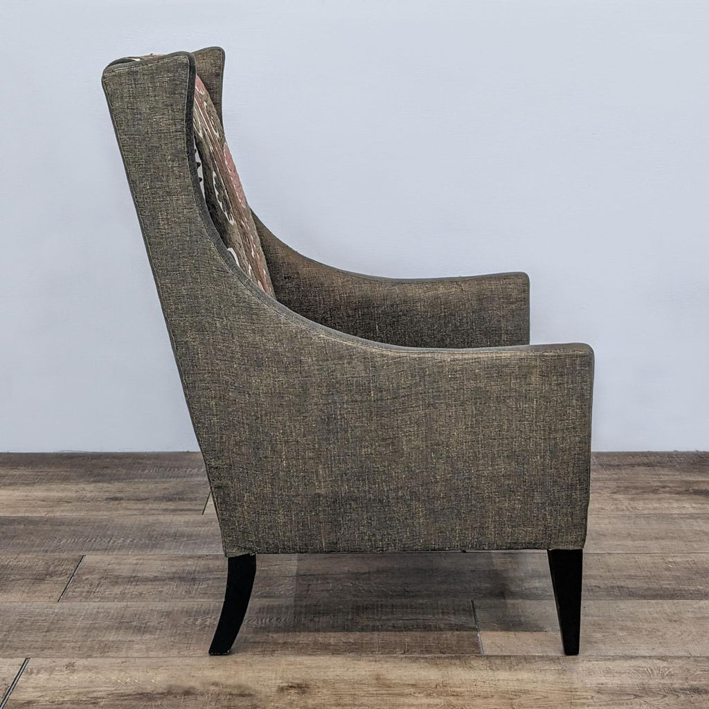 Side and rear views of an Andrew Martin Pluto chair showcasing its winged armrests and high back with earthy upholstery.