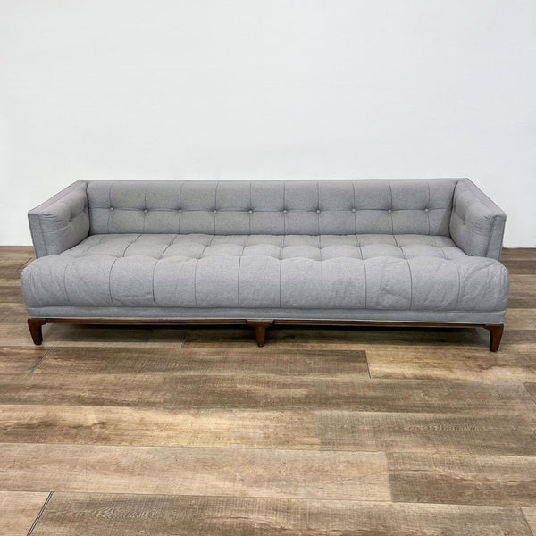 Gray 90" tufted three-seat sofa with frame arms and wooden legs from Reperch, shown in a frontal view.