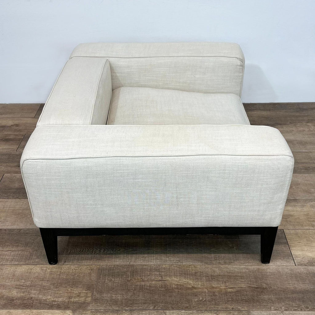 Contemporary Camerich lounge chair in neutral tone fabric with dark wood legs, depicted from different angles.