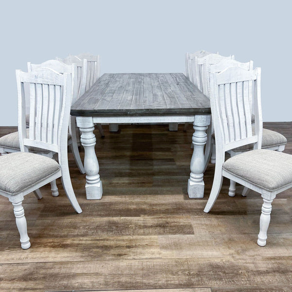 Ashley Furniture Havalance 7-piece Dining Set with distressed wood table and white upholstered chairs in a vintage farmhouse style.