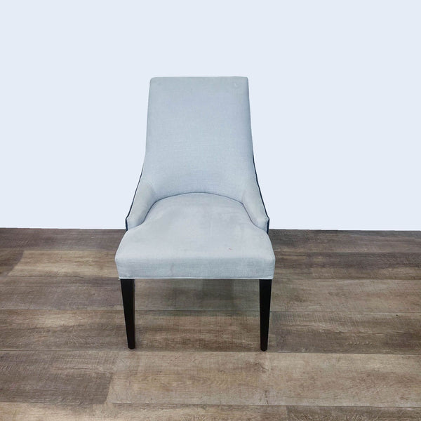 Alt text 1: Modern Duralee dining chair with a high back and armless design, featuring a light gray cushioned seat on dark wood legs.